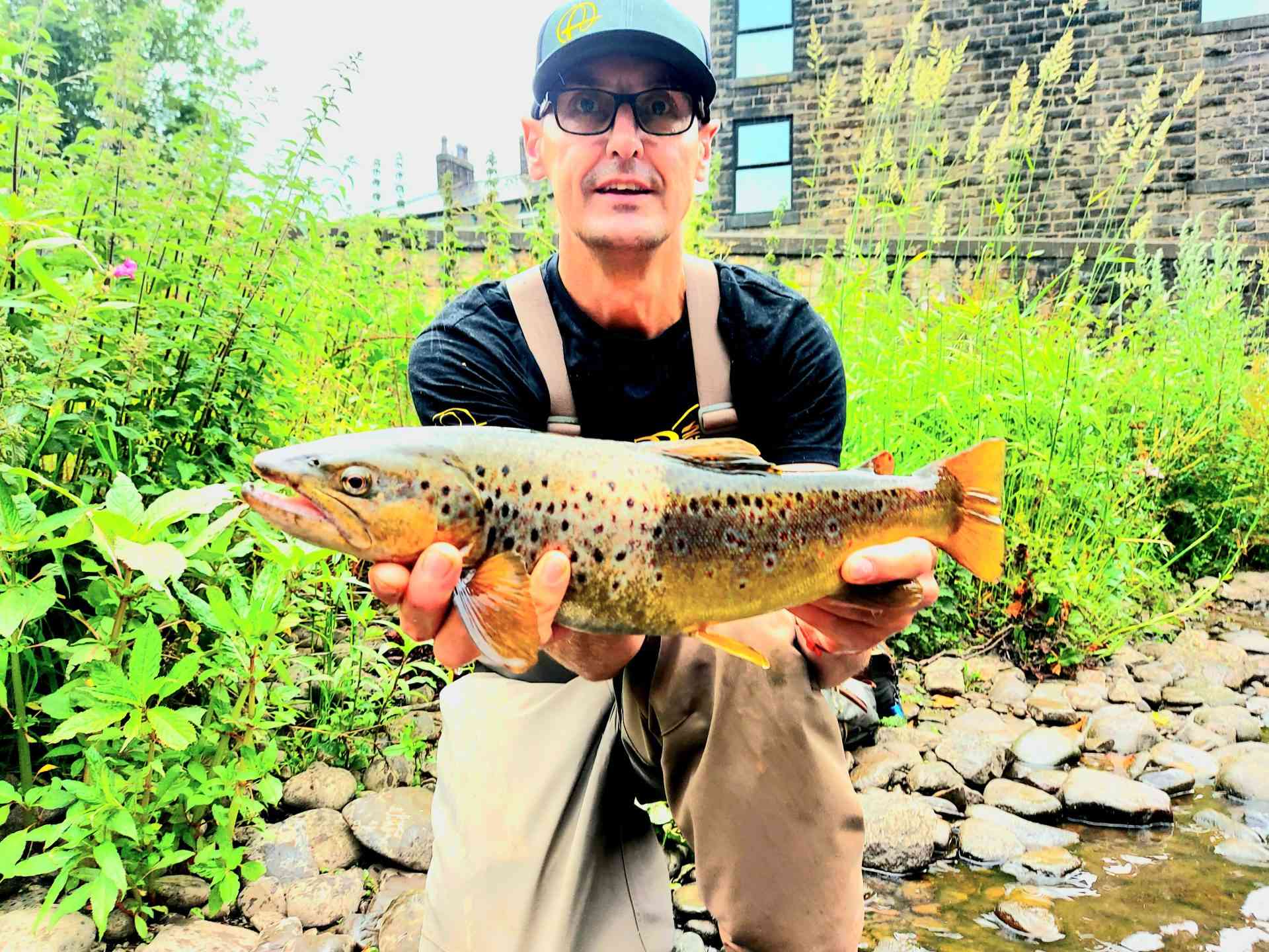 Man holding a brown trout